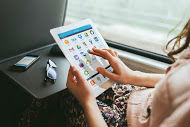 user-seated_on_train-ipad_and_iphone-ol_app_screen