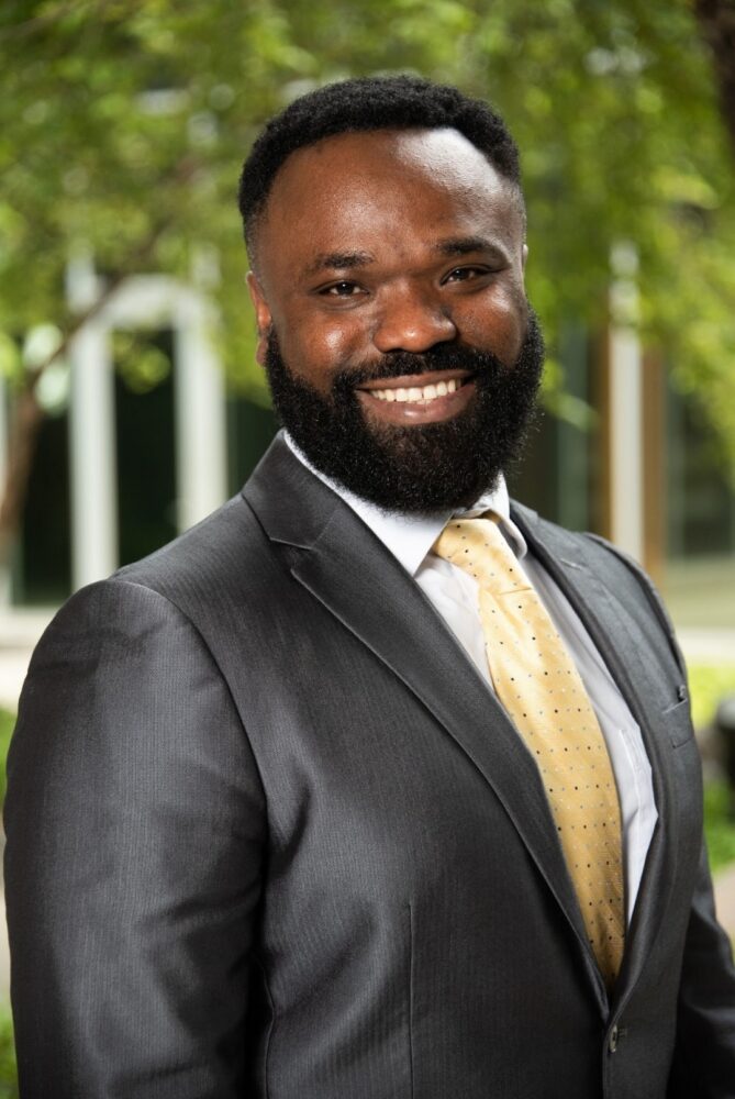 Smiling man wearing a black suit-cyber